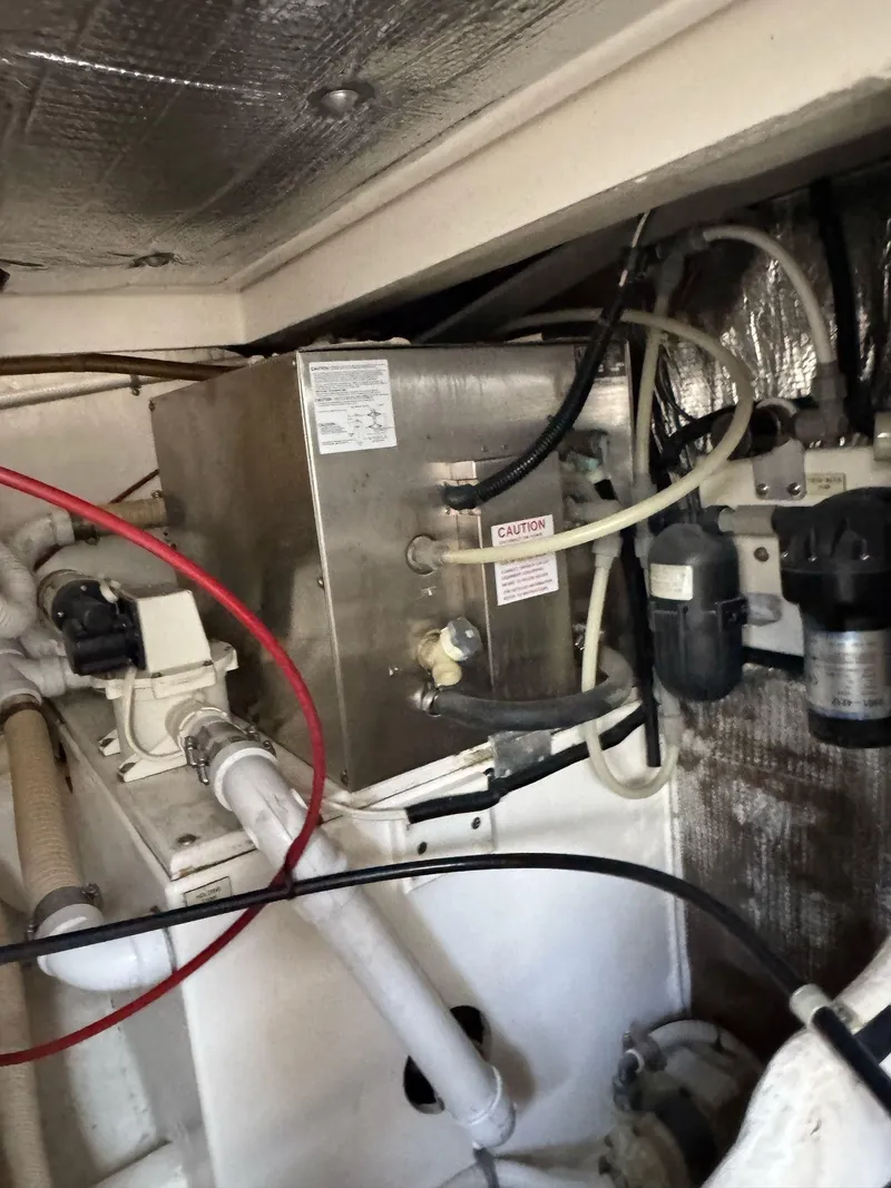 Slide: The Image of Engine room of 1998 Cabo 35 Express boat with mechanical components. - 48