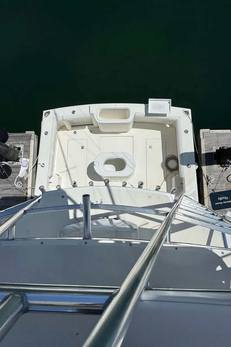 Slide: The Image of Overhead view of 1998 Cabo 35 Express boat docked at marina. - 8