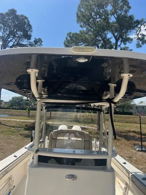 Slide: The Image of 2020 Sea Chaser 30 HFC CC boat with T-top, parked outdoors. - 15