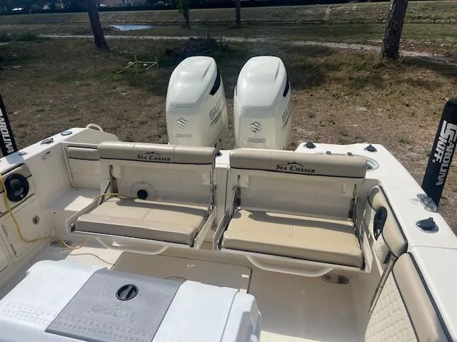 Slide: The Image of 2020 Sea Chaser 30 HFC CC boat with dual Suzuki engines, featuring comfortable seating. - 19