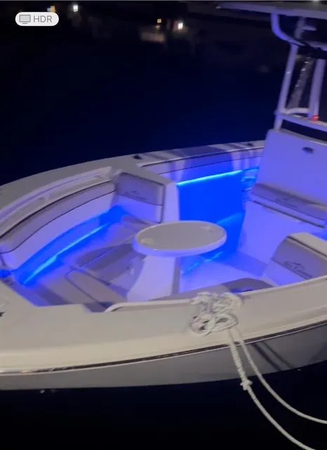 Slide: The Image of 2020 Sea Chaser 30 HFC CC boat with blue LED lights at night. - 23