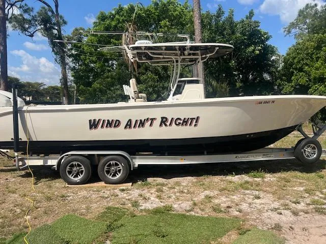 Slide: The Image of 2020 Sea Chaser 30 HFC CC boat on trailer, labeled "Wind Ain't Right!" - 5