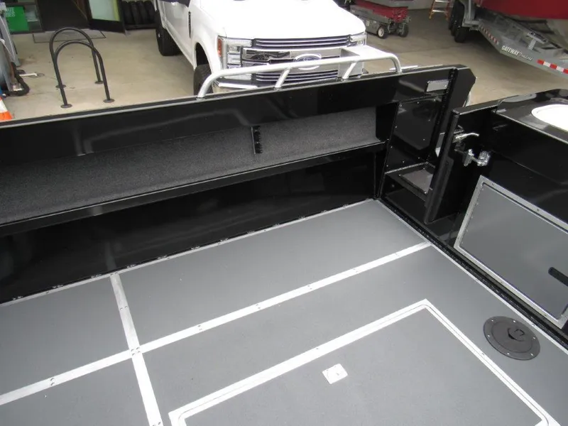 Slide: The Image of Interior of 2025 North River 23 SEAHAWK RTF boat, featuring spacious deck and storage compartments. - 10