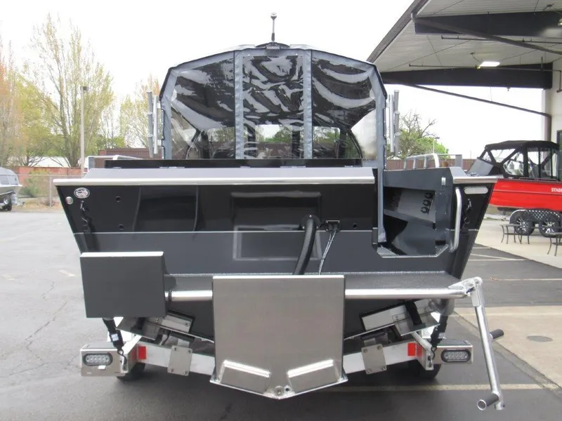 Slide: The Image of 2025 North River 23 SEAHAWK RTF boat, rear view in a showroom setting. - 4