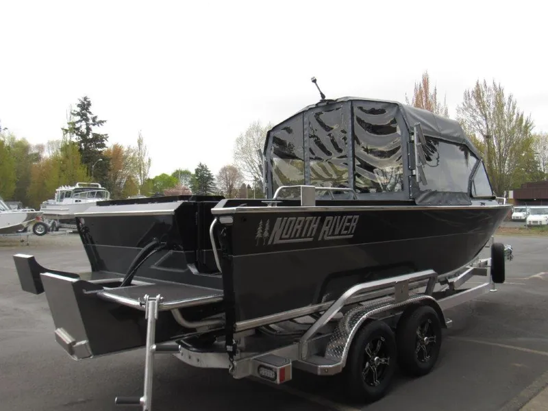 Slide: The Image of 2025 North River 23 SEAHAWK RTF boat on trailer, parked outdoors. - 5
