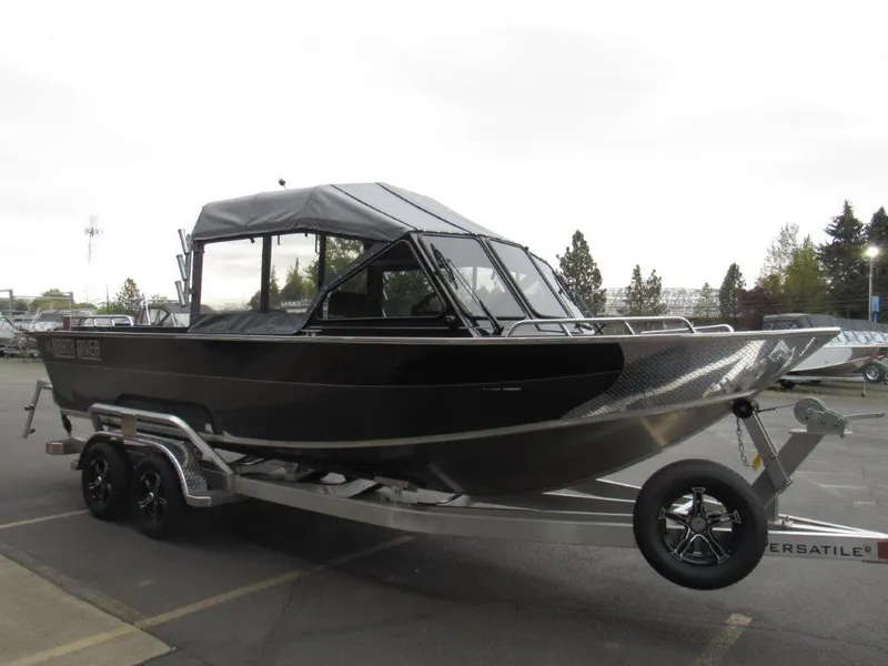 Slide: The Image of 2025 North River 23 SEAHAWK RTF boat on trailer, parked outdoors. - 7
