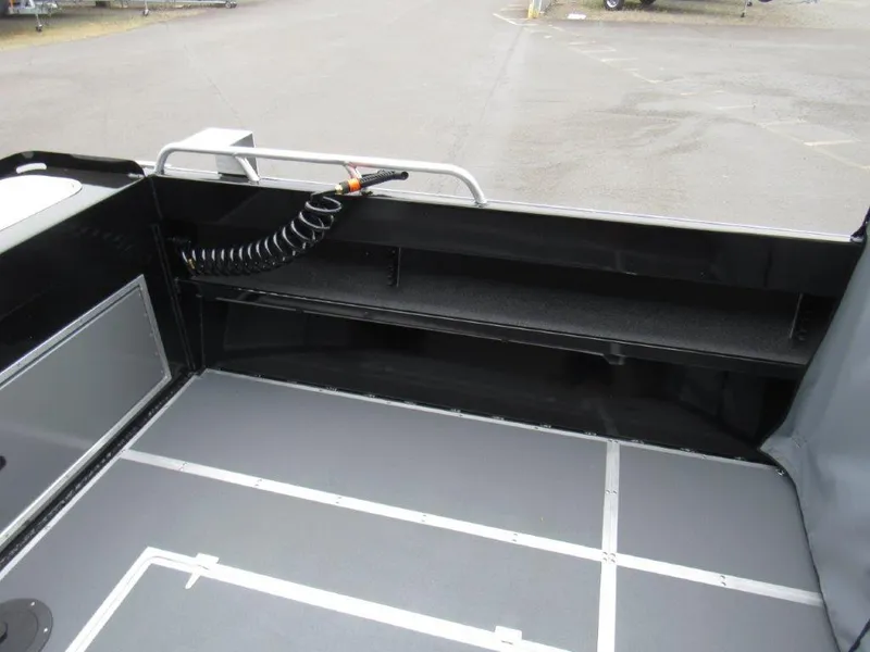 Slide: The Image of Interior view of 2025 North River 23 SEAHAWK RTF boat, showcasing deck and storage area. - 9