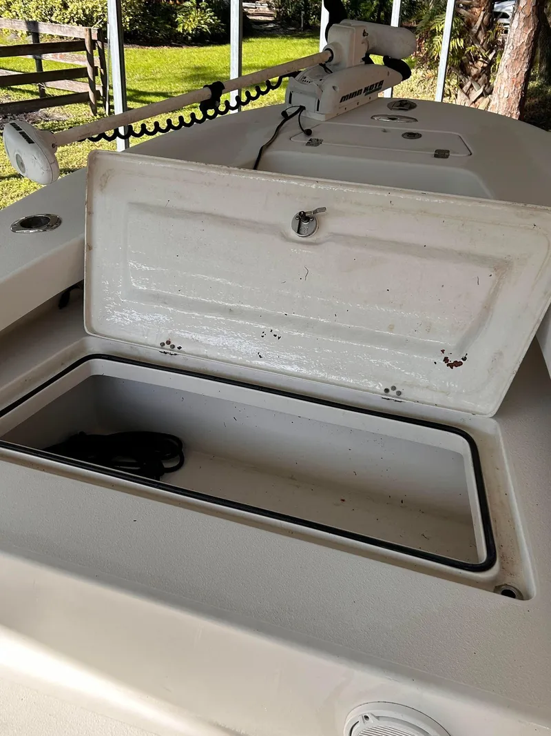 Slide: The Image of Open storage compartment on 2014 Andros Guide 20 boat, with visible trolling motor. - 11