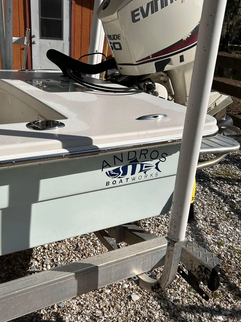 Slide: The Image of 2014 Andros Guide 20 boat with Evinrude motor on a trailer. - 4