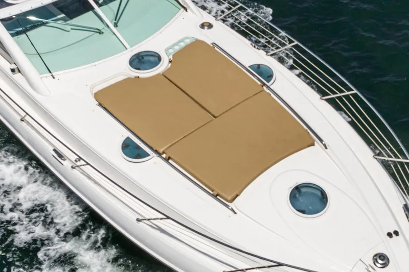 Slide: The Image of Fairline 48 Targa 2000 yacht with sunbathing deck cruising on water. - 10