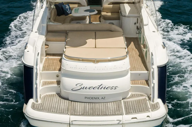 Slide: The Image of Fairline 48 Targa yacht, 2000 model, named "Sweetness," cruising on the ocean. - 14