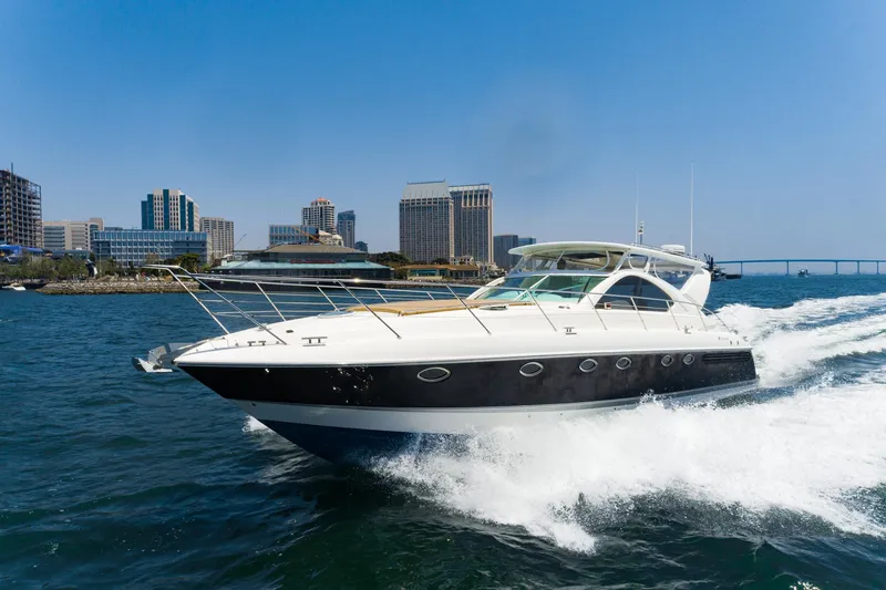 Slide: The Image of Fairline 48 Targa yacht cruising in urban waterfront, 2000 model. - 2