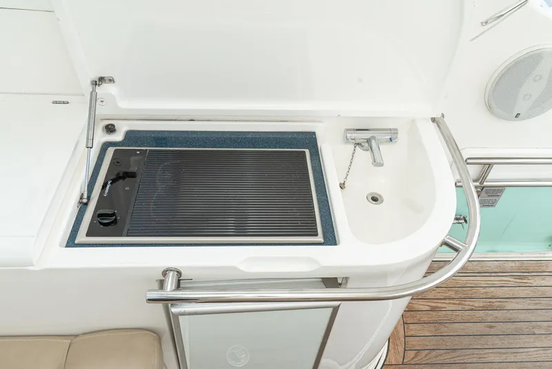 Slide: The Image of Outdoor kitchenette on 2000 Fairline 48 Targa yacht with grill and sink. - 24