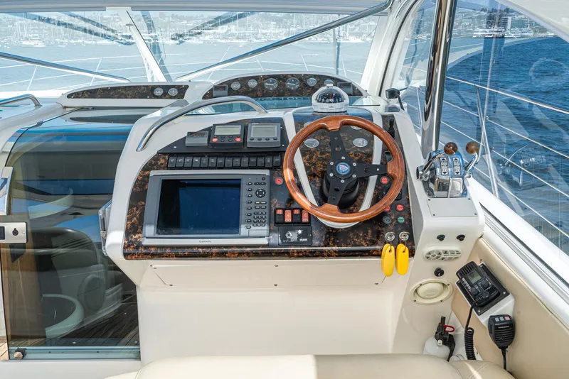 Slide: The Image of Helm of 2000 Fairline 48 Targa yacht with navigation equipment and wooden steering wheel. - 29