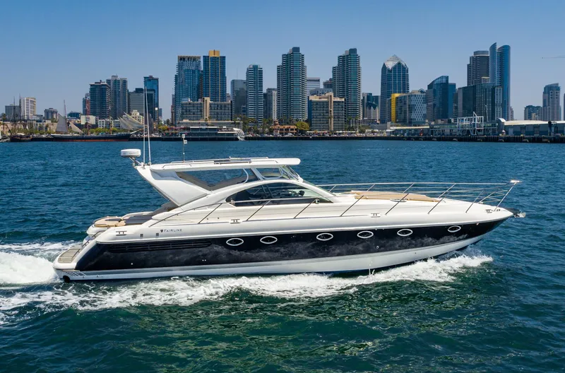 Slide: The Image of Fairline 48 Targa yacht cruising with city skyline backdrop, 2000 model. - 3
