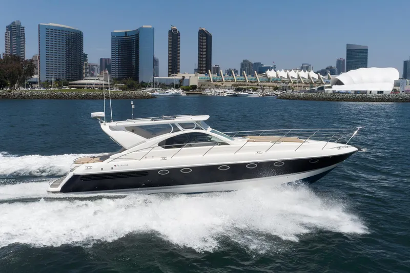 Slide: The Image of Fairline 48 Targa yacht cruising near city skyline, 2000 model. - 4