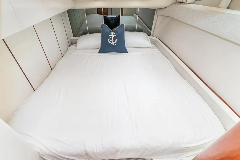 Slide: The Image of Cozy bedroom in 2000 Fairline 48 Targa yacht with nautical-themed decor. - 43
