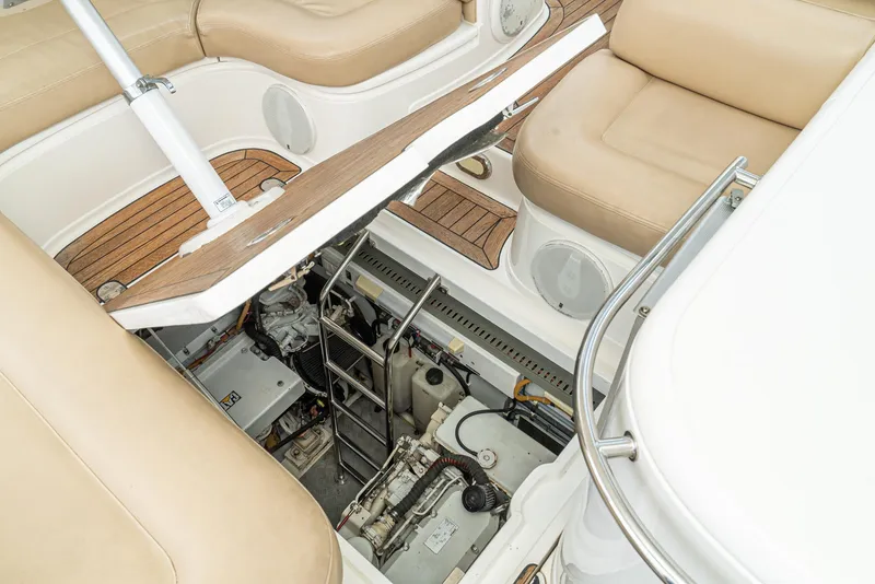 Slide: The Image of Engine compartment of 2000 Fairline 48 Targa yacht with beige seating and ladder access. - 47