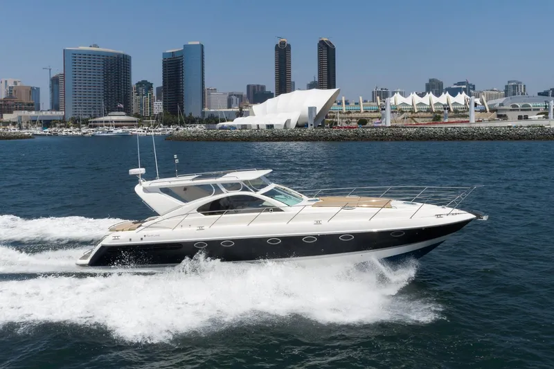 Slide: The Image of Fairline 48 Targa yacht cruising near city skyline, 2000 model. - 5