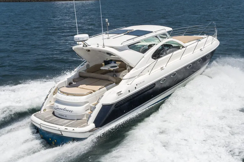 Slide: The Image of Fairline 48 Targa 2000 yacht cruising on open water, showcasing sleek design and luxury features. - 6