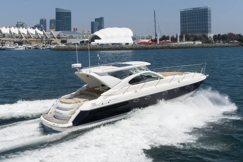Slide: The Image of Fairline 48 Targa yacht cruising in urban harbor, 2000 model. - 7