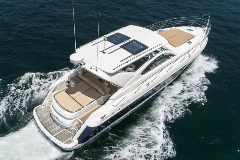 Slide: The Image of Fairline 48 Targa 2000 yacht cruising on open water, aerial view. - 8
