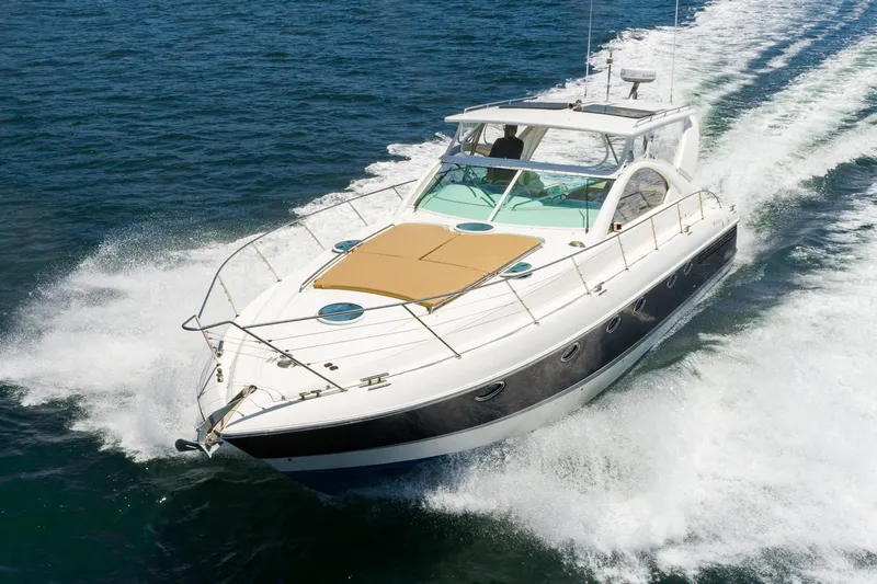 Slide: The Image of Fairline 48 Targa 2000 yacht cruising on open water, showcasing sleek design and performance. - 9
