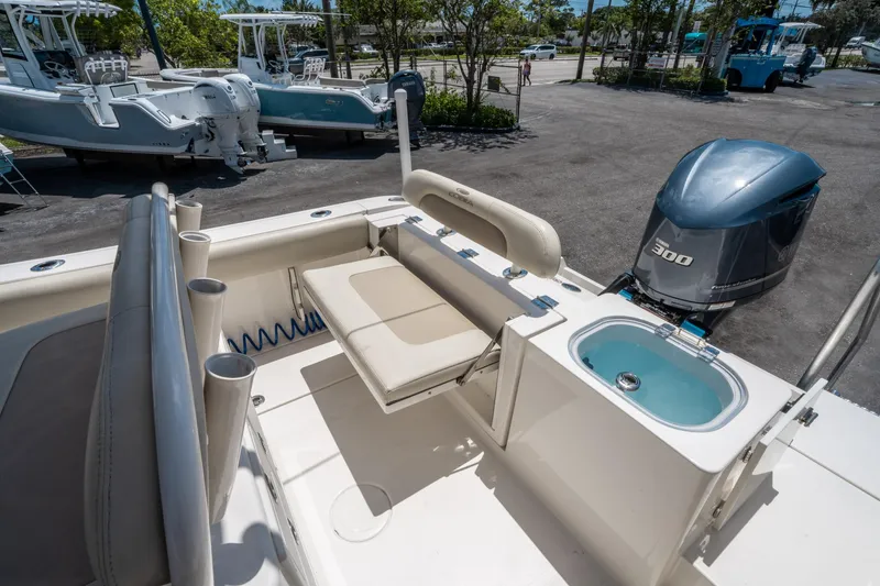 Slide: The Image of 2017 Cobia 237 CC boat with Yamaha 300 engine, featuring seating and livewell. - 12