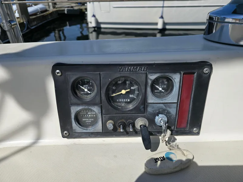 Slide: The Image of Control panel of a 1985 Pearson 385 sailboat with Yanmar engine gauges. - 13