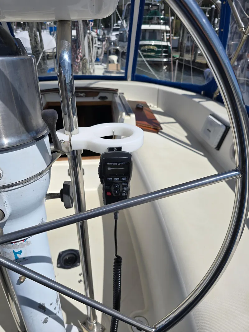 Slide: The Image of Steering wheel and controls on a 1985 Pearson 385 sailboat cockpit. - 14