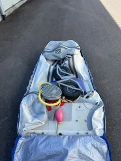 Slide: The Image of Inflatable boat with accessories on pavement, Pearson 385, 1985 model. - 30