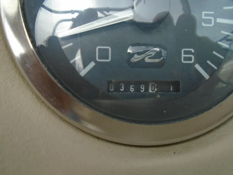 Slide: The Image of Close-up of a 1997 Sea Ray 210 Bowrider boat gauge showing 369 hours. - 8