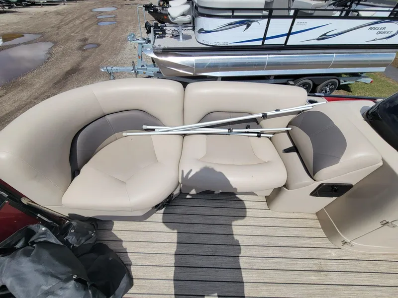 Slide: The Image of 2021 Landau 220 Atlantis boat interior with beige seating and metal frame on deck. - 12