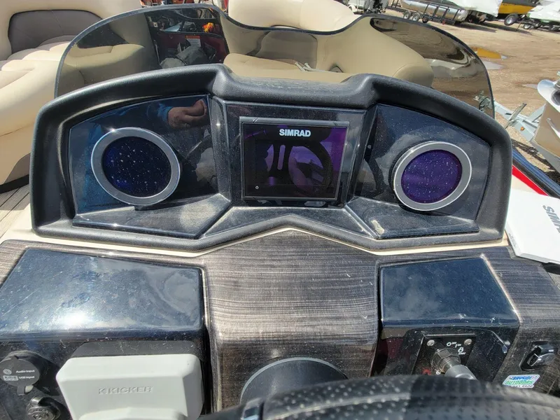 Slide: The Image of Dashboard of 2021 Landau 220 Atlantis boat with Simrad display and controls. - 16