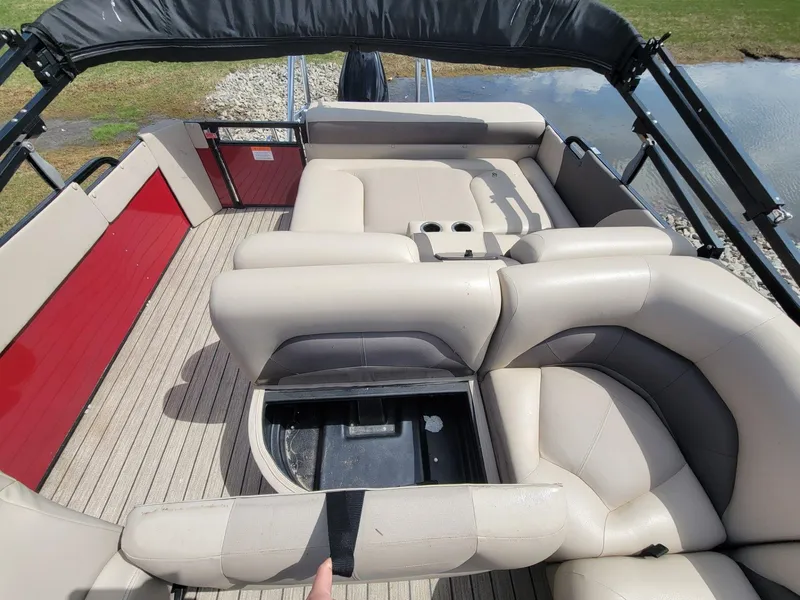 Slide: The Image of 2021 Landau 220 Atlantis boat interior with beige seating and red accents. - 24