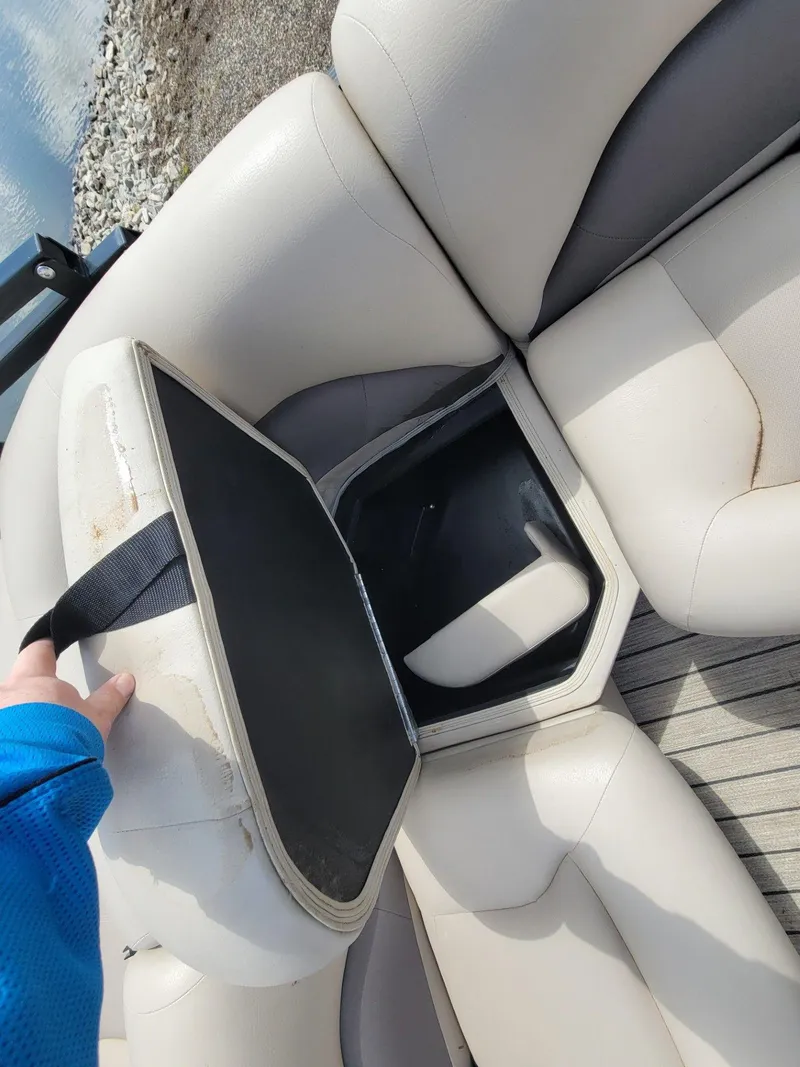Slide: The Image of Open storage compartment in 2021 Landau 220 Atlantis boat seat. - 25