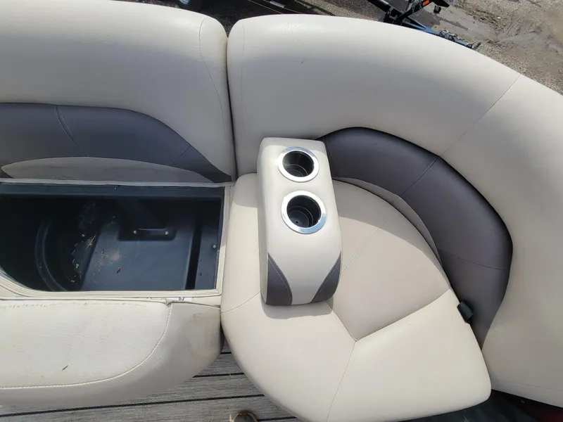 Slide: The Image of 2021 Landau 220 Atlantis boat seating with cup holders and storage compartment. - 28