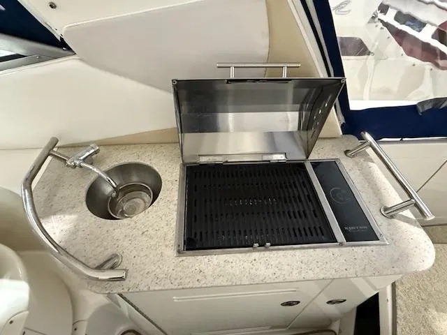 Slide: The Image of Outdoor kitchenette on 2009 Sea Ray 350 Sundancer with sink and grill. - 12