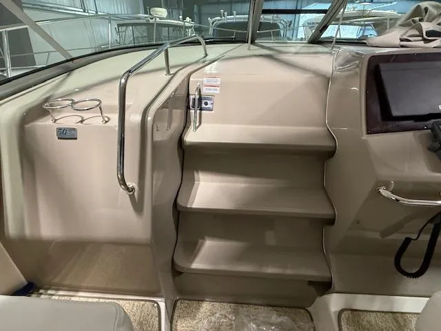 Slide: The Image of Interior stairs of a 2009 Sea Ray 350 Sundancer yacht, featuring beige design and handrails. - 14