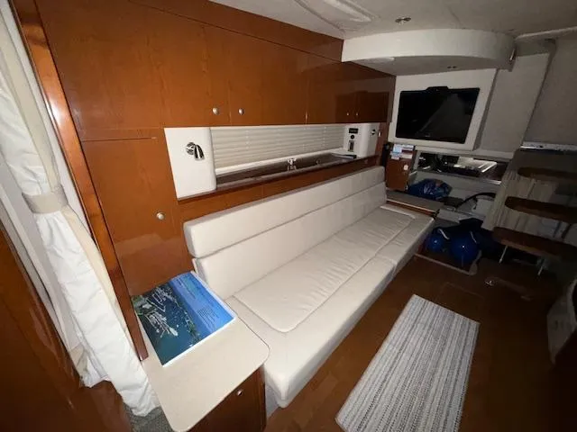 Slide: The Image of Luxurious interior of 2009 Sea Ray 350 Sundancer yacht with modern seating and wood finishes. - 20
