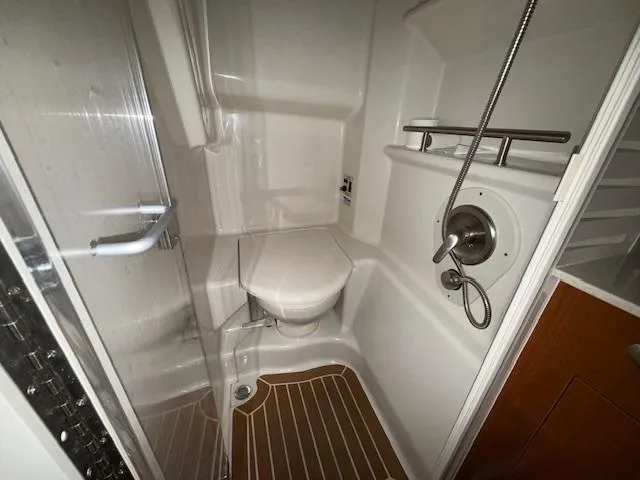 Slide: The Image of Bathroom interior of 2009 Sea Ray 350 Sundancer yacht with shower and toilet. - 27