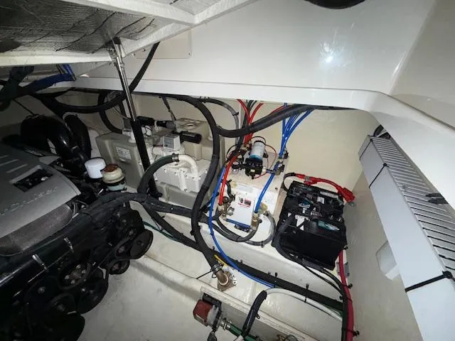 Slide: The Image of Engine compartment of a 2009 Sea Ray 350 Sundancer with visible wiring and components. - 31