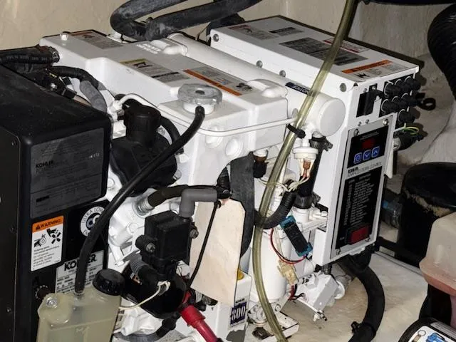 Slide: The Image of Engine room of a 2009 Sea Ray 350 Sundancer with visible mechanical components. - 32