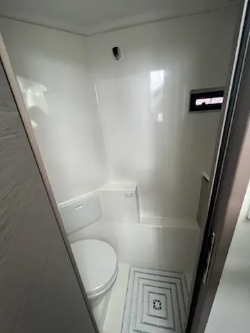 Slide: The Image of 2022 Fountaine Pajot MY4.S yacht bathroom with modern white interior design. - 17