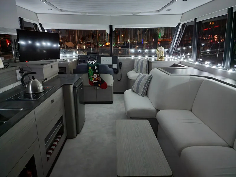 Slide: The Image of Luxurious interior of 2022 Fountaine Pajot MY4.S yacht, featuring modern decor and ambient lighting. - 19