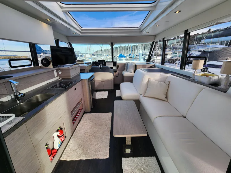 Slide: The Image of Luxurious interior of 2022 Fountaine Pajot MY4.S yacht with modern furnishings and marina view. - 3