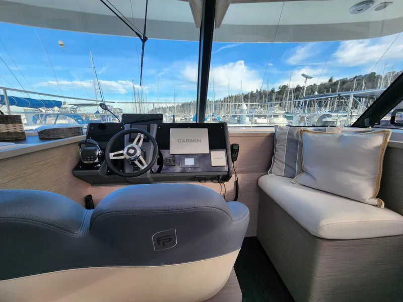 Slide: The Image of Interior of 2022 Fountaine Pajot MY4.S yacht with steering wheel and navigation system. - 4