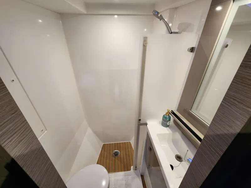 Slide: The Image of Compact bathroom in 2022 Fountaine Pajot MY4.S yacht with shower and sink. - 9