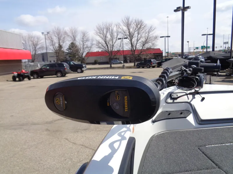 Slide: The Image of 2024 Ranger 1850MS boat with Minn Kota Terrova trolling motor in a parking lot. - 12