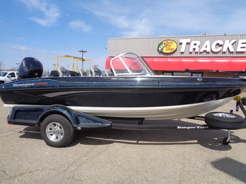 Slide: The Image of 2024 Ranger 1850MS boat on trailer outside Bass Pro Shops. - 2